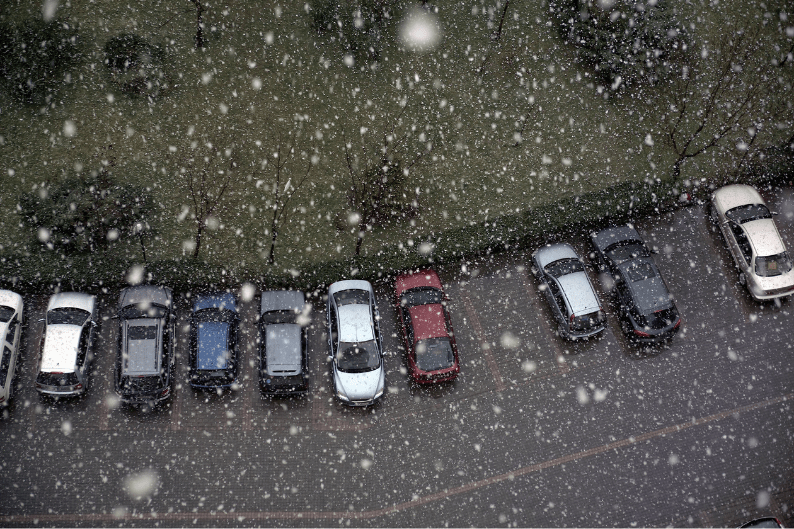 cars in parking lot during winter